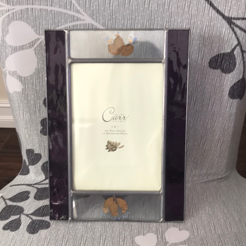 Picture frame holds 5 x 7 photo.